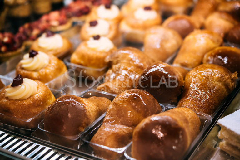 Different types of desserts on sale at a bakery in Naples, Campania, Italy.